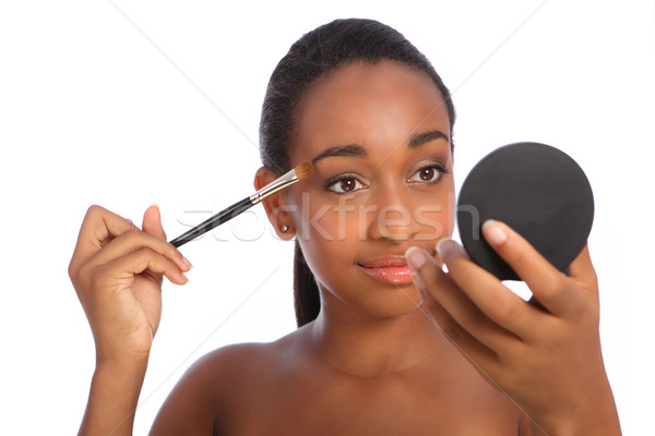 African woman eye shadow make up cosmetics brush Stock photo © darrinhenry
