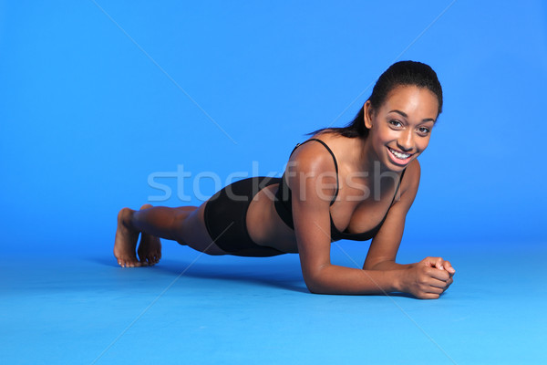 Plank ab exercise by happy African American woman Stock photo © darrinhenry