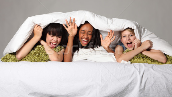 Hilarious laughter fun at teenage slumber party Stock photo © darrinhenry