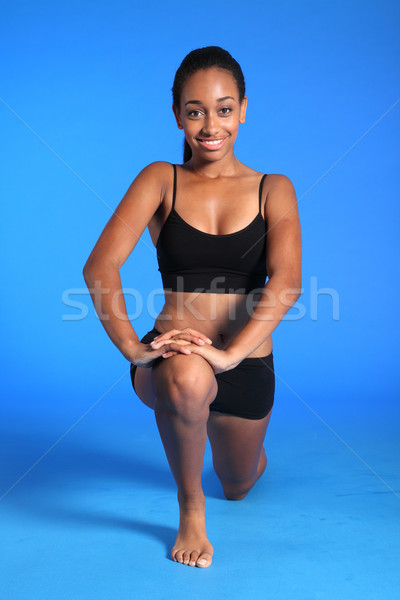 Kneeling hip flexor stretch by fit black woman Stock photo © darrinhenry