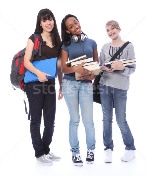 Happy teenage ethnic student girls in education Stock photo © darrinhenry
