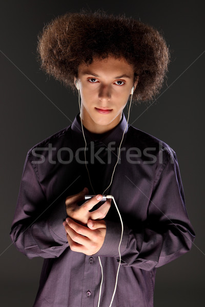 Big bushy afro hair teenager listening to music Stock photo © darrinhenry