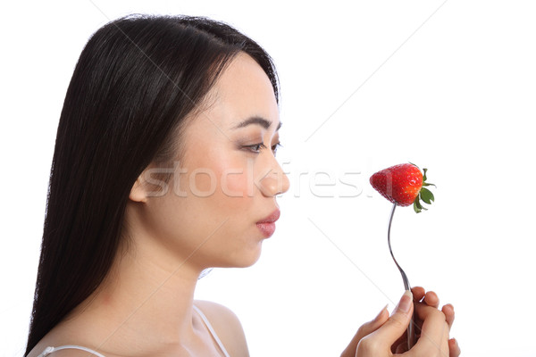 Pretty young oriental girl with strawberry fruit Stock photo © darrinhenry