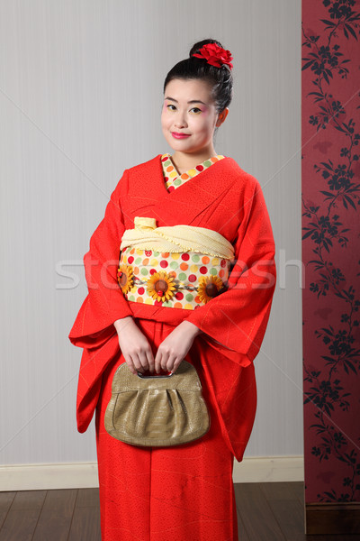 Oriental woman in red traditional japanese kimono Stock photo © darrinhenry