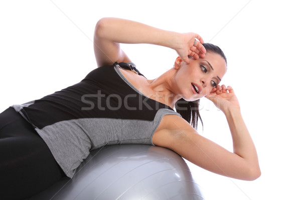 Stomach crunches by fit woman on exercise ball Stock photo © darrinhenry