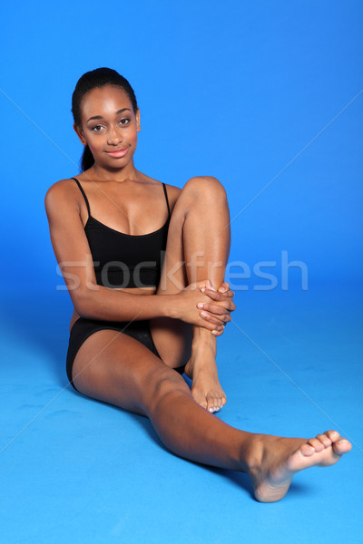 Fit body of young African American woman on floor Stock photo © darrinhenry