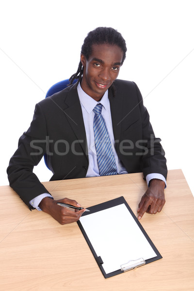 Young African American businessman at office desk Stock photo © darrinhenry