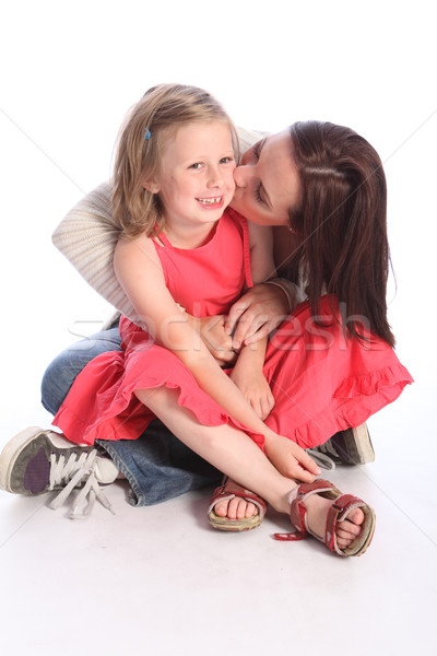Kiss on cheek a mothers love to young daughter Stock photo © darrinhenry