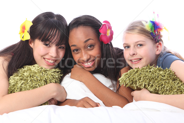Teenage girls flowers in hair at sleepover party Stock photo © darrinhenry