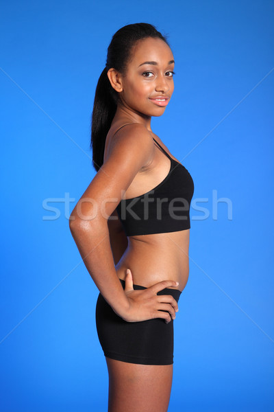 Side view of beautiful african american athlete Stock photo © darrinhenry