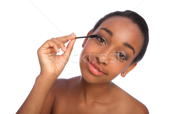 Stock photo: African American woman eyelash separator brush