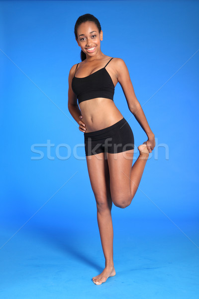 Sporting African American woman thigh stretch Stock photo © darrinhenry