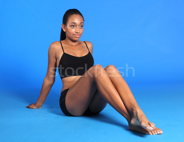 Beautiful athletic African American woman sitting Stock photo © darrinhenry