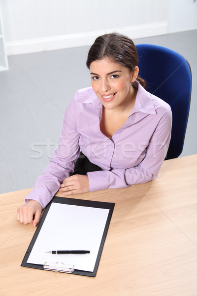 Office worker woman at desk with pen and paper Stock photo © darrinhenry