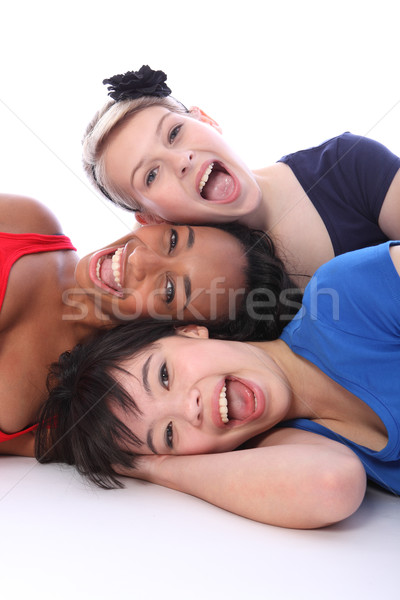 Mixed race happy girls tower of smiling faces Stock photo © darrinhenry