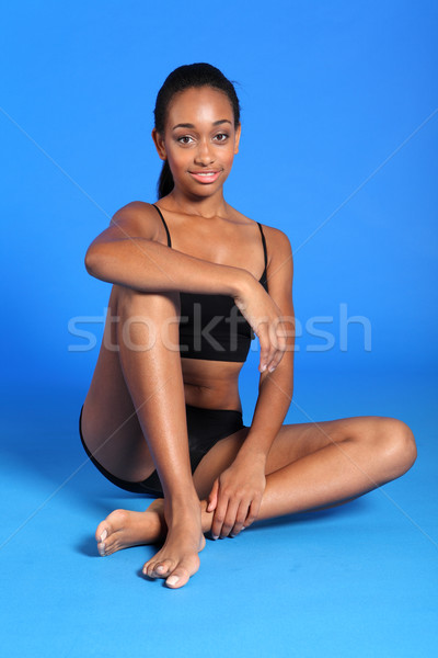 Athletic african sportswoman with fit healthy body Stock photo © darrinhenry