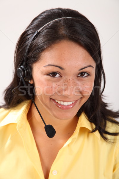 Bella sorridere femminile receptionist auricolare Foto d'archivio © darrinhenry