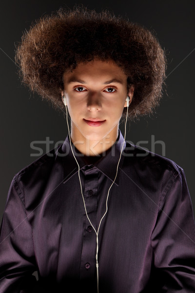 Junger Mann Musik Ohr groß afro Haar Stock foto © darrinhenry