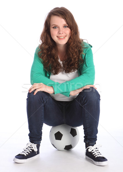 On the ball a cheerful teenager girl soccer player Stock photo © darrinhenry