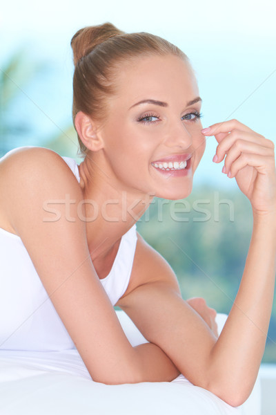 Beautiful high-spirited woman laughing Stock photo © dash