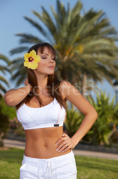 Fleur jaune ans exotique fille corps [[stock_photo]] © dash