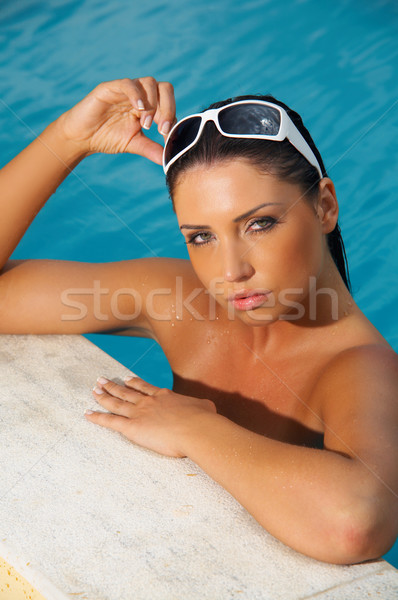Woman in swimming pool Stock photo © dash