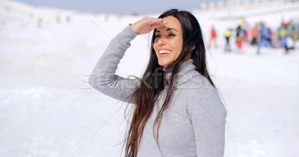 Gorgeous smiling young woman at a ski resort Stock photo © dash