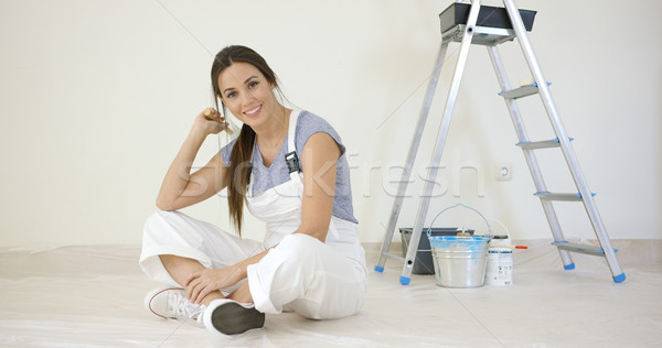 Pretty young woman renovating her home Stock photo © dash