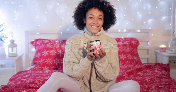 Pretty y woman admiring her Christmas coffee cup Stock photo © dash