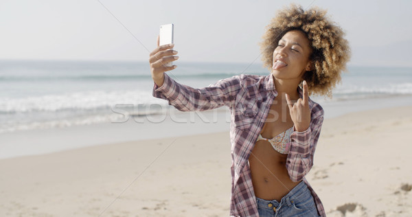 Young Woman Doing Selfie On The Beach Stock photo © dash