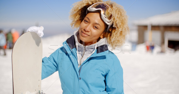 Gorgeous trendy young woman with her snowboard Stock photo © dash