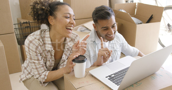 Boldog félvér pár megbeszél laptopot használ új Stock fotó © dash