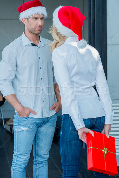 Young woman surprising her husband at Xmas Stock photo © dash