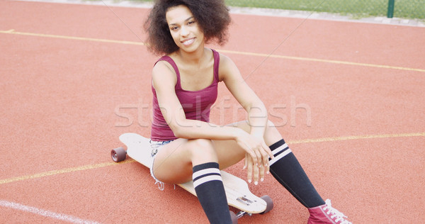 Stock photo: Confident sportive girl on skateboard