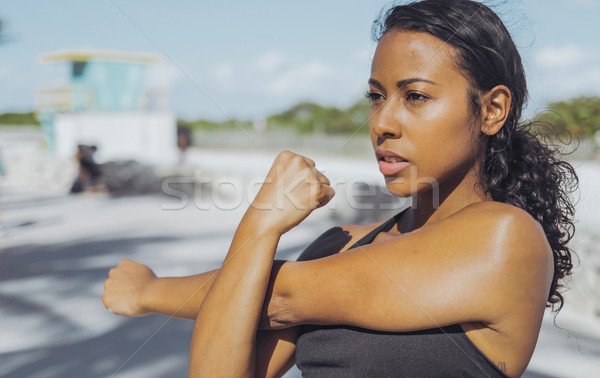 Pretty black girl warming up in park Stock photo © dash