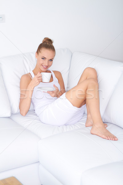 Pretty woman relaxing at home with coffee Stock photo © dash