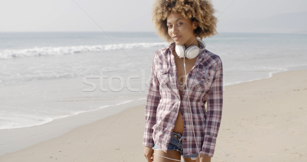 Girl With Headphones Walking On The Beach Stock photo © dash