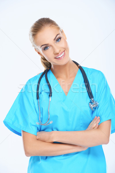 Smiling Medical Doctor on Light Blue Scrub Suit Stock photo © dash