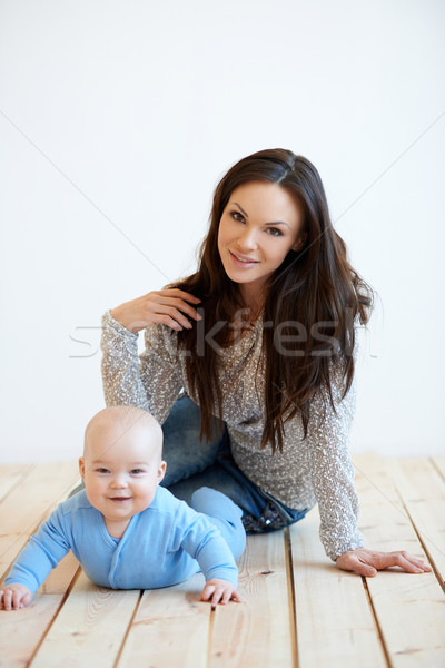 Mother and Baby on Floor Looking at Camera Stock photo © dash