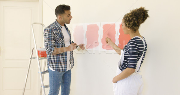 Young couple debating a new paint color Stock photo © dash