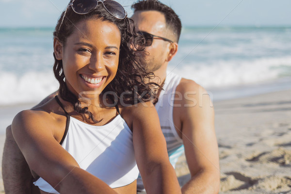 Pretty black girl with boyfriend on beach Stock photo © dash