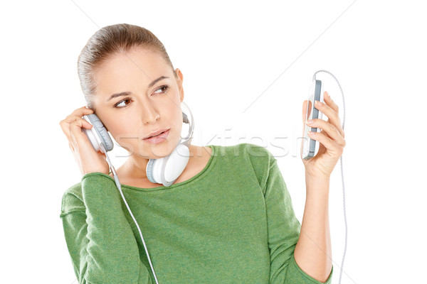 Stock photo: Woman listening to a new music download