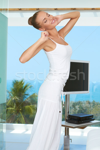 Elegant shapely woman stretching Stock photo © dash