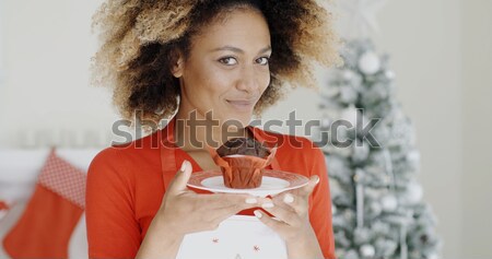 Young woman sipping a cup of hot lemon tea Stock photo © dash