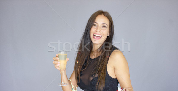 Vivacious woman having fun at a New Year party Stock photo © dash