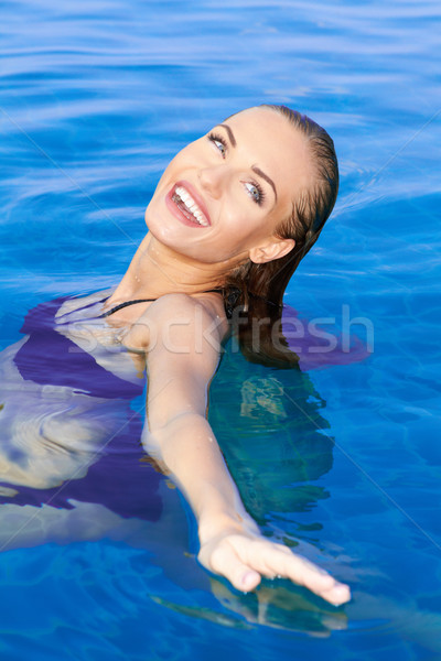 Beautiful Woman Relaxing In Pool Stock photo © dash