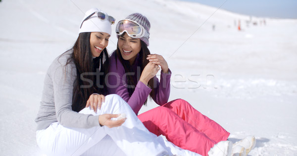 Two Friends Sitting Together on Sunny Ski Hill Stock photo © dash