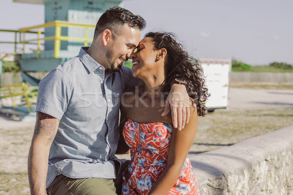 Happy multiracial couple on seafront Stock photo © dash
