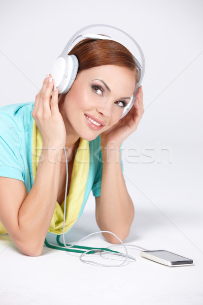 Ouvir música jovem bonitinho mulher piso Foto stock © dash