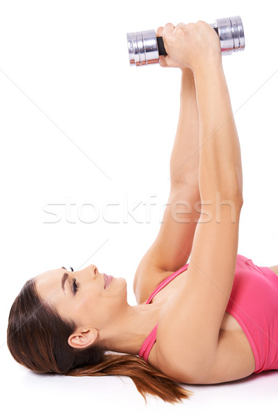 Stock photo: Woman exercising with dumbbells
